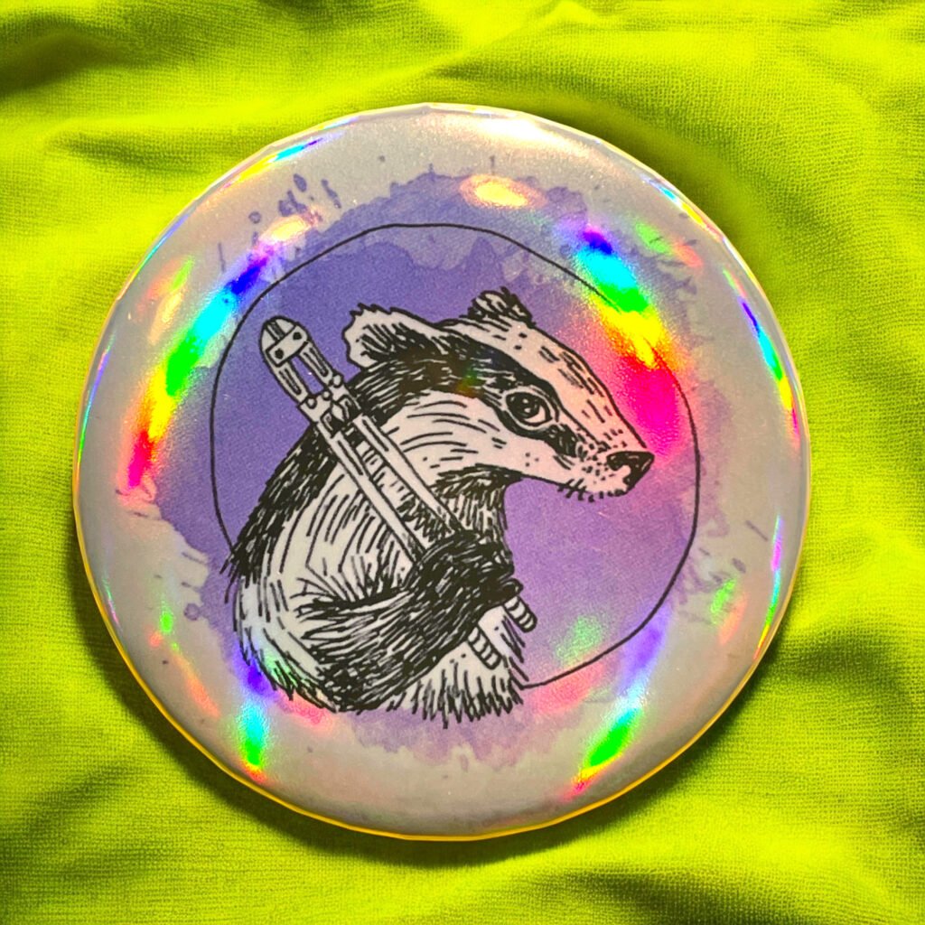 Badge holographique Blaireau avec pinces par Lashka
