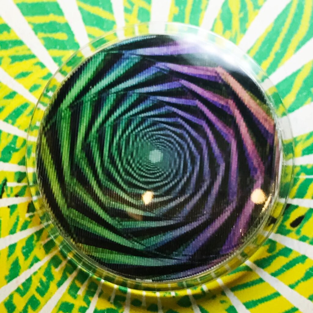 Badge animé lenticulaire spirale psychédélique colorée
